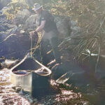Liam being an absolute machine lining canoes down a portage!